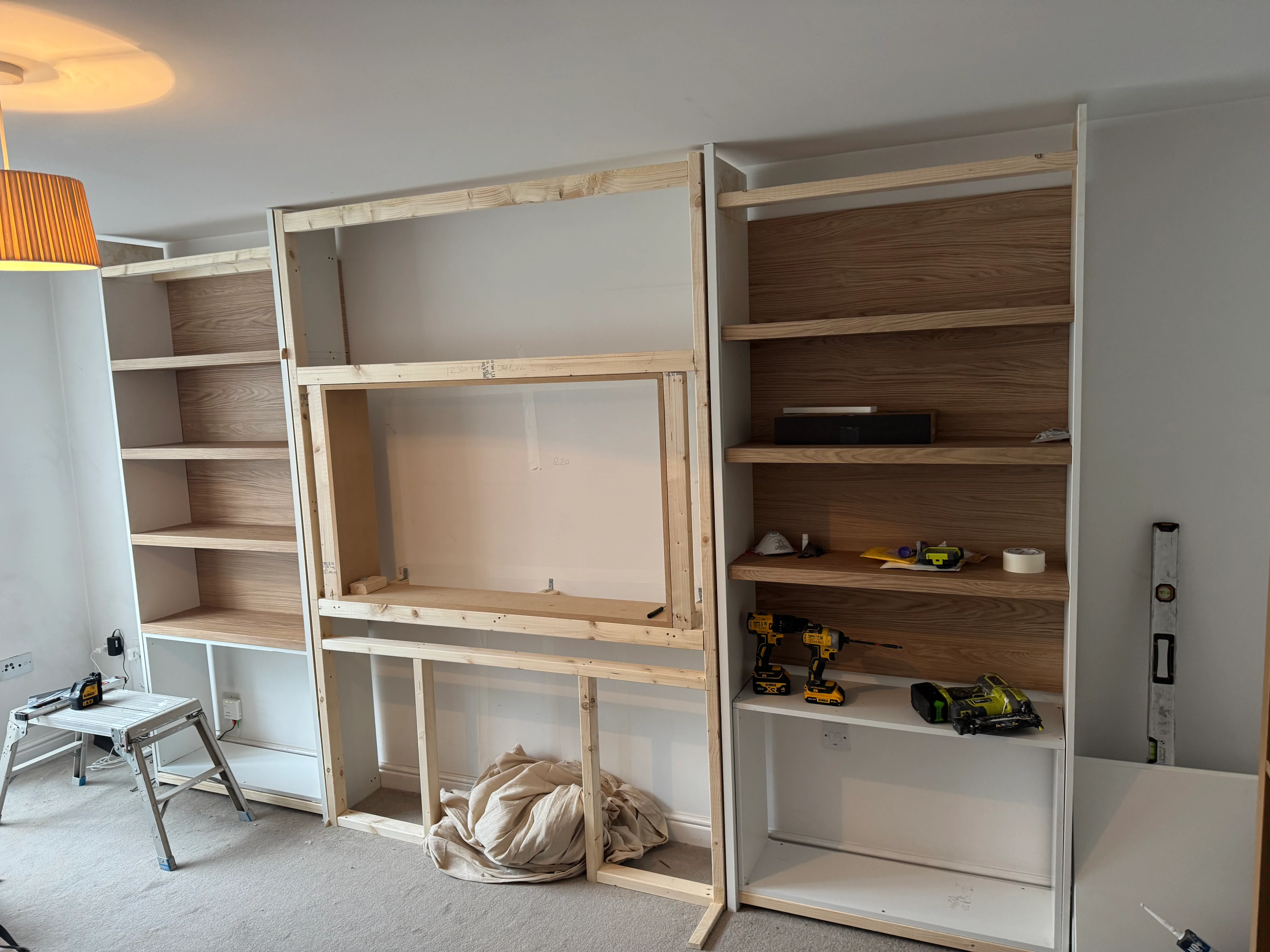 The Canton media wall part-built, framework and shelving in place